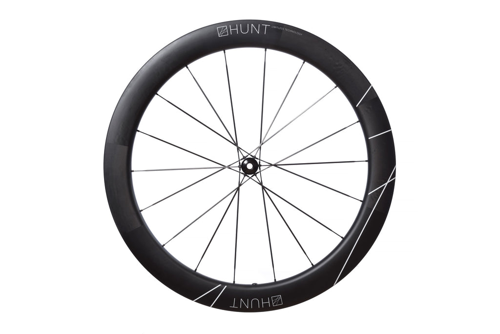 Side-on image of the front HUNT 60 Limitless UD Carbon Spoke disc wheel in the studio
