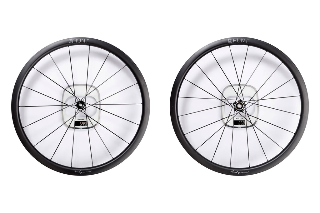 Image showing the weights of the front and rear HUNT 32 Aerodynamicist UD Carbon Spoke Disc Wheels, with the front weighing in at 545g and the rear weighing 668g