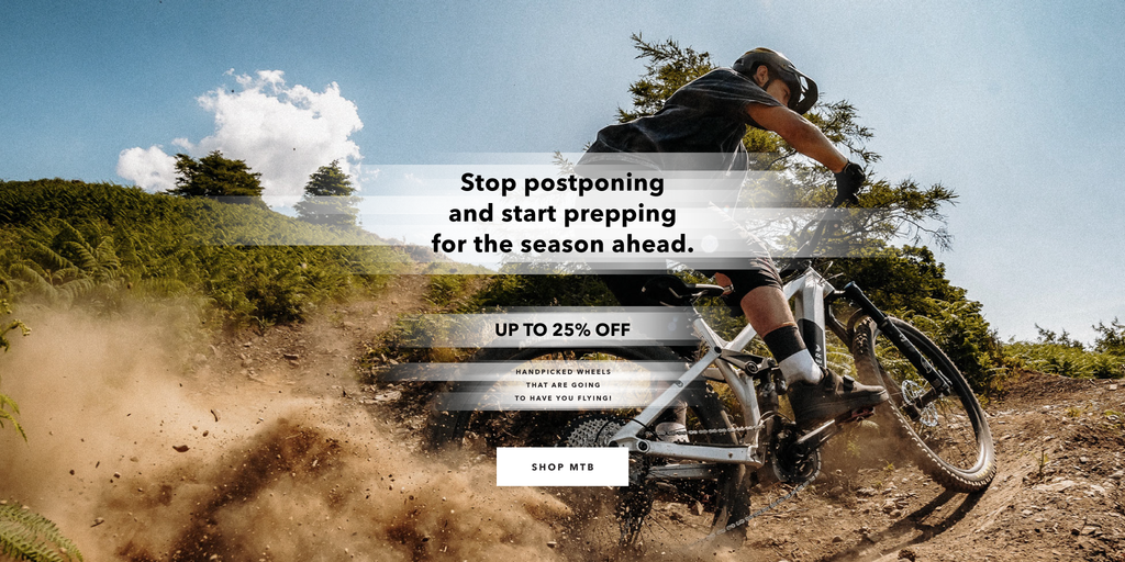 Mountain biker riding Privateer MTB with HUNT 25% off discount text