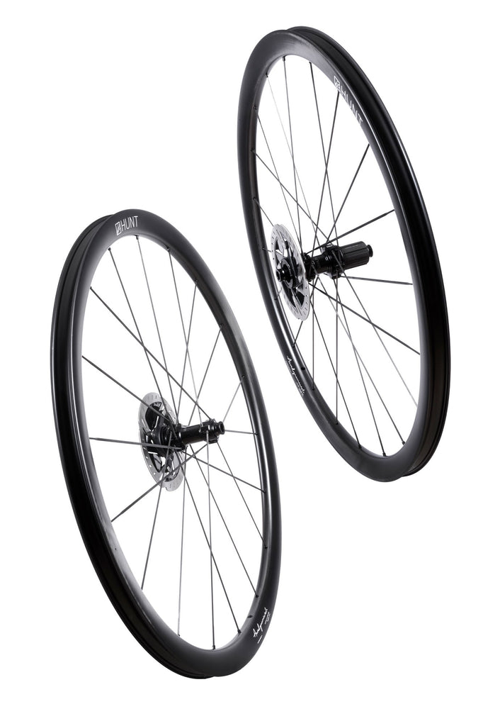 A pair of HUNT 34_34 Aerodynamicist UD Carbon Spoke Disc Bike Wheels.
