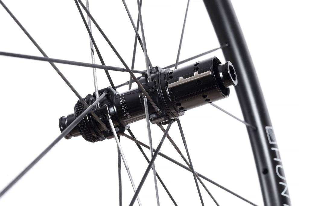 <h1>Freehub Body</h1><i>A drilled out high-strength axle and freehub body (Shimano HG) for further weight reduction. The HG freehub body includes the HUNT signature anti-bite steel insert for protection against cassette gouging, with alloy splines removed to save precious grams.</i>