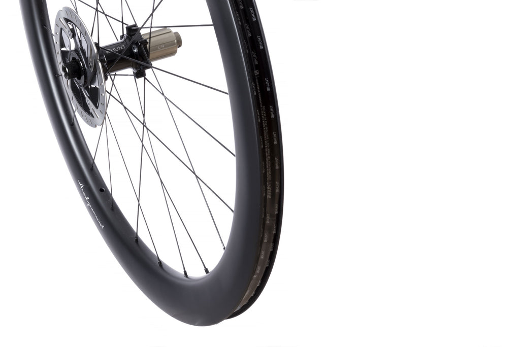 Up close image of the HUNT 54 Aerodynamicist Carbon Disc rear wheel, showing the detailed rim design