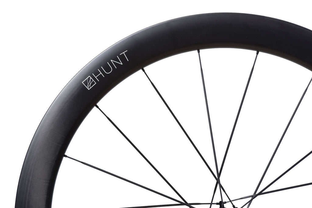 Image showing the UD Carbon Spokes from the HUNT 54 UD Carbon Spoke Disc Wheelset, with their bladed design allowing for enhanced power transfer and aerodynamic performance