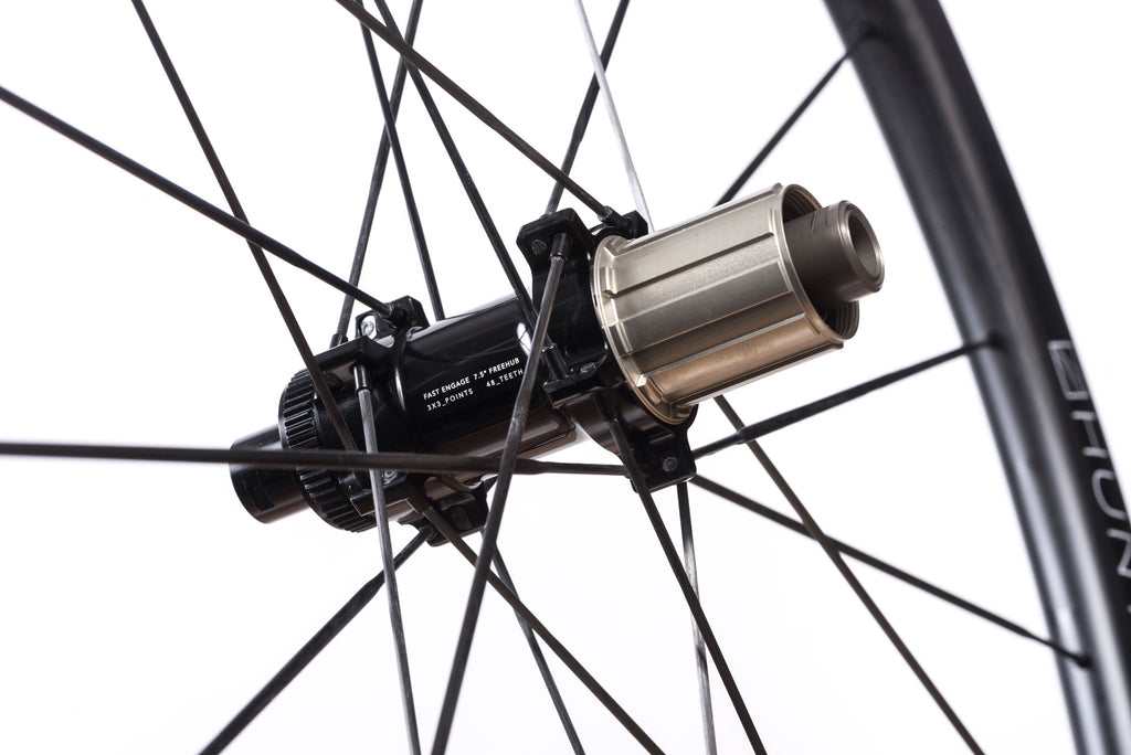Detailed image of the rear hub of the HUNT 32 Aerodynamicist UD Carbon Spoke Disc Wheelset