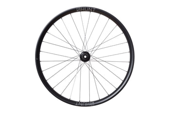 <h1>Rims</h1><i>A strong and lightweight hookless rim featuring unidirectional T24/30 carbon fibre with 3K weave re-enforced spoke holes. An asymmetric shape which is inverted from front to rear to provide balanced higher spoke tensions meaning tighter spokes for longer. Disc specific rims allow higher strength to weight as no reinforcement is required for a braking surface. The extra wide rim at 33mm (26mm internal) creates a great profile for wider tyres, giving more grip and lower rolling resistance.</i>